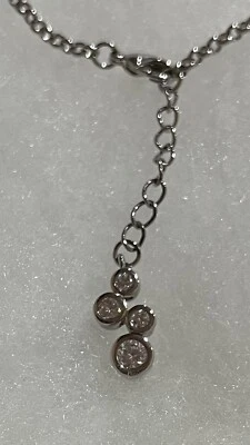 silver tone bracelet with dangling circle design with White, Clear Stones. - Image 1 of 4