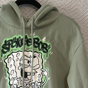 H&M SpongeBob Sweater Adult Large Green Graffiti Pullover Hoodie EUC - Picture 1 of 8