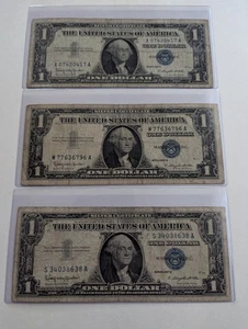 US Three, One Dollar, 1957 B, $1 Silver Certificates, Blue Seal  - Picture 1 of 2