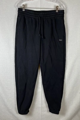 Pantalones deportivos Aritzia TNA acogedores de vellón calce novio talla mediana negros gruesos Foto 1 de 4