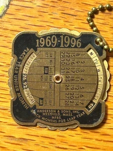 Metal Pocket Calendar / KEY CHAIN  1969 - 1996  ROCK ISLAND IL MC CABE DRY GOODS - Picture 1 of 3