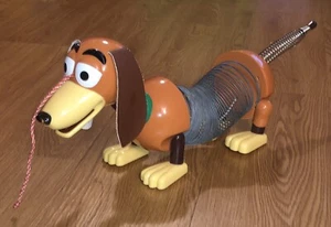 Juguete de colección 1999 Disney Pixar TOY STORY Slink Slinky Dog Pull James Industries - Imagen 1 de 11
