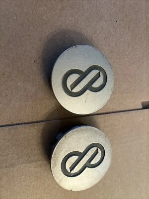 04-06 Tapacubos centrales ENKEI Scion XA OEM 00041-12980-02 69572 PLATA #SM2 (CANTIDAD 2 Foto 1 de 4