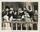 Press Photo Group Surrounding Table in "Tom Sawyer" Movie Scene - lry29764