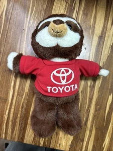 NWT Fiesta Travel Tails Raccoon Wearing Toyota Shirt - Picture 1 of 6