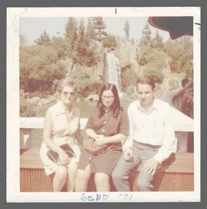 Found Photo 1971 3 People On Wall In Park 3.5 x 3.5 - Picture 1 of 2