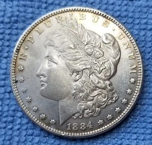 1884 $1 MORGAN DOLLAR 90% SILVER - Picture 1 of 2