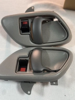 (2) Front door handles with bezels Interior Gray  New In Box ‘99 to 05 GMC Chevy - Image 1 of 4