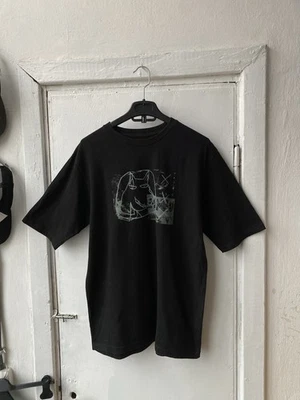 Camiseta vintage de gran tamaño con gráfico de mambo 2008 Foto 1 de 4