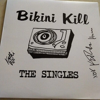 SIGNED Bikini Kill - The Singles  LP autograph signed by band - Image 1 of 3