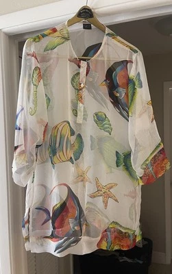 Ropa de playa Cejón cubierta, mediana, tercera imagen muestra enganche en el brazo izquierdo. Foto 1 de 4