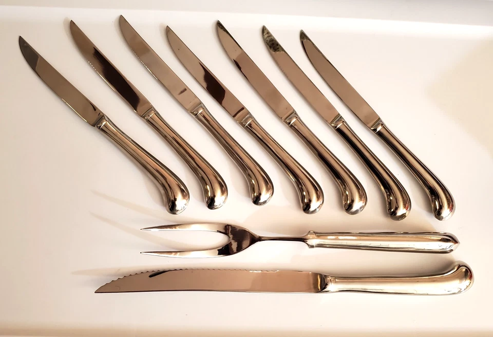 JUEGO DE TALLA DE ACERO INOXIDABLE (Cuchillo y Tenedor) y 7 CUCHILLOS PARA CARNE - Excelente estado Foto 1 de 4