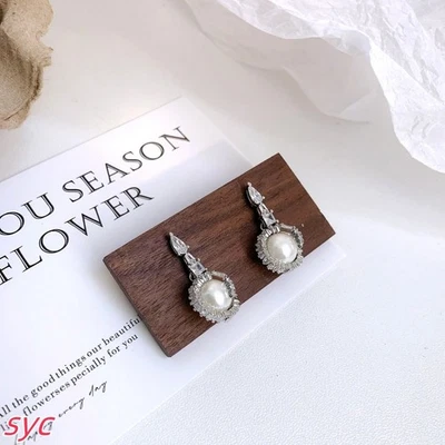 New teardrop shaped earrings imitating crystal pearls, mixed cut, white, rhodium - Image 1 of 4