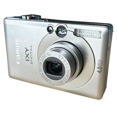 Canon IXY DIGITAL 50 fotocamera compatta argento con batteria e... - Immagine 1 di 4