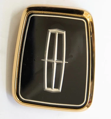 1988-90 Lincoln CONTINENTAL trunk lock cover emblem *GOLD* - Image 1 of 4