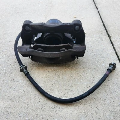 Pinza de freno delantera izquierda lado del conductor Nissan Rogue Select 2008-2015 OEM* Foto 1 de 4