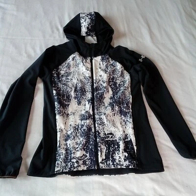 Chaqueta cortavientos Under Armour OutRun The Storm para mujer pequeña ajustada impermeable Foto 1 de 4