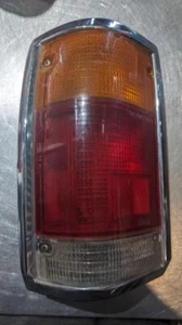 1987-1993 MAZDA B-2200 DRIVER SIDE (LEFT) TAIL LIGHT W/ CHROME MOULDING - Picture 1 of 6