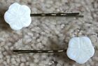 2 White Carved Shell adorned Hair Grips