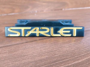 Toyota Starlet EP91 1997 Front Grille Emblem Badge c/w Bracket JDM OEM 753211037 - Picture 1 of 19