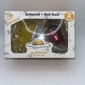 Kidrobot Gudetama Sunburned & Shell Stuck Vinyl Figure 2-Pack (Life is Pain) - Foto 1 di 6