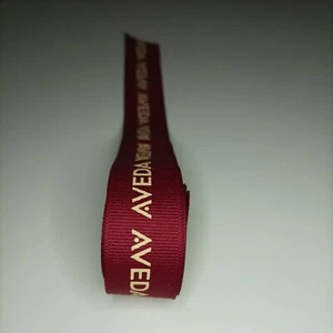 AVEDA RED RIBBON WITH CREAM LETTERING 138CM LONG x 2 CM WIDE NEW - Picture 1 of 3