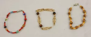 Lote de 3 pulseras vintage de cuentas de plástico y tono dorado de madera 12 - Imagen 1 de 1