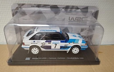 Mazda 323 4WD Carlsson Rally di Svezia 1989 1/24 IXO Scatola di cartone - Immagine 1 di 3