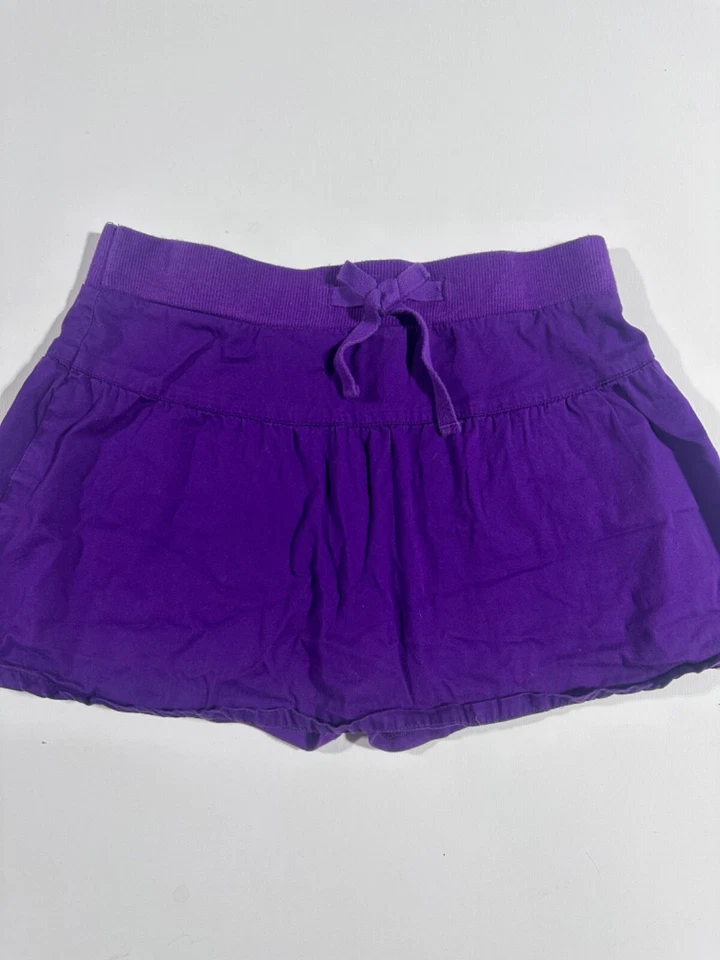 Falda corta descolorida Glory púrpura lisa talla niña 10/12 L grande usada en excelente estado Foto 1 de 4