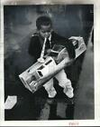 1977 Press Photo Boy with Gifts at Doll & Toy Fund Event - nod01229