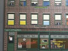 Flat Building for O Scale train sets Merchandise Store front. With lighted sign.
