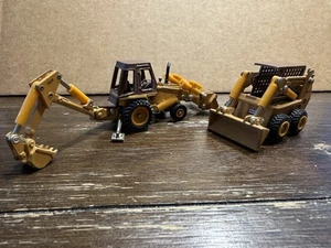 Vintage ERTL Case 580E Backhoe Loader AND ERTL Case 1845C Skid Steer 1/64 Scale - Picture 1 of 11
