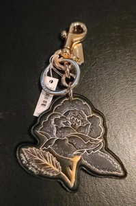 COACH NWT CHELSEA Black/Gold Tatoo Leather Rose Bag Charm Key Ring FOB F75521 - Picture 1 of 2