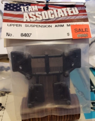 Team Associated 8407 Front Upper Suspension Arms Mounts Black RC12LS/W RC10L - Image 1 of 3