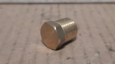 HOLLOW BRASS PLUG (1/4” NPTF, .560” OVER HEX, .680” LG.)  X111B - Image 1 of 4