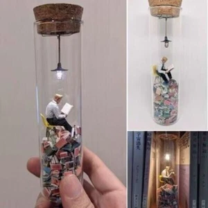 Siphonate A Reading Man in a Test Tube Resin Reader Model - Bild 1 von 5