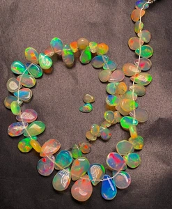 Ethiopian Opal Natural pear Shape Briolette Smooth Multi Fire 4x5-7.50x10 MM - Picture 1 of 18