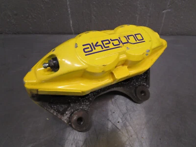 1 pinza de freno usada Akebono 2015 Infiniti Q50 amarilla Foto 1 de 4