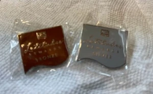 2 neue NCL Latitudes Rewards Tier Pins Norwegian Cruise Bronze & Silber Neu in Verpackung - Bild 1 von 1