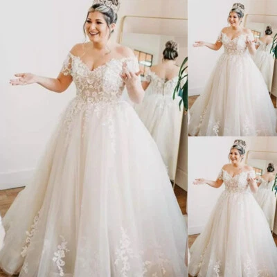 Vestidos de novia talla grande con apliques de encaje blanco marfil Foto 1 de 4