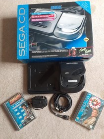 Sega CD ROM entertainment system for genesis with AC adapter and 2 games