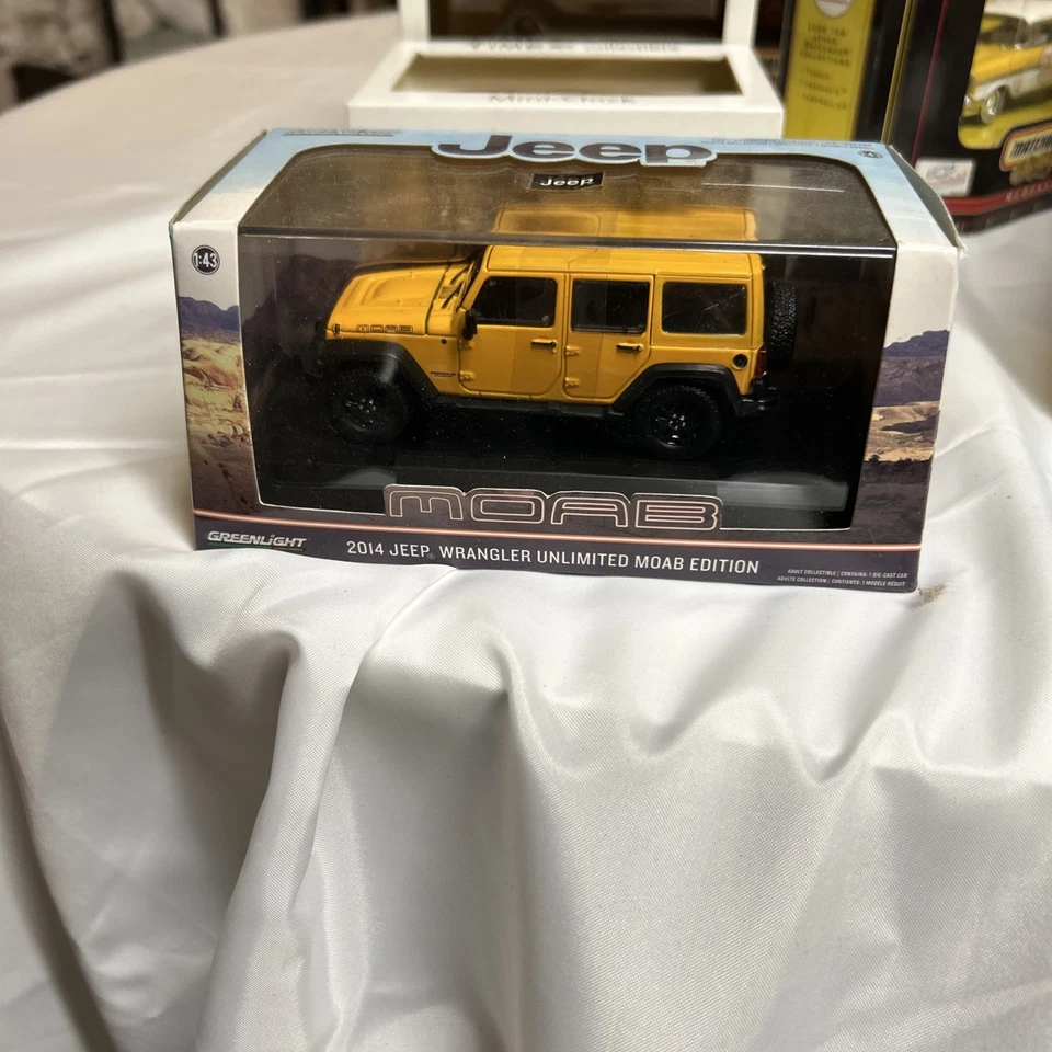 Jeep Wrangler Unlimited 2014 Greenlight 1/43 MOAB amarillo nuevo en caja Foto 1 de 1