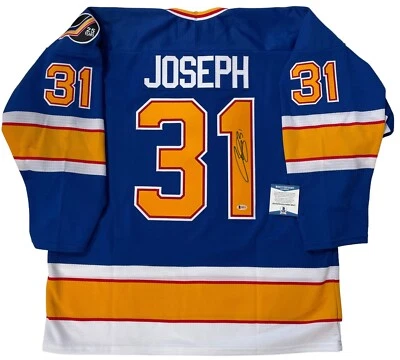 JERSEY BLUES 1991 FIRMADO POR CURTIS JOSEPH FIRMADO BECKETT CERTIFICADO DE AUTENTICIDAD GRANDE Foto 1 de 4