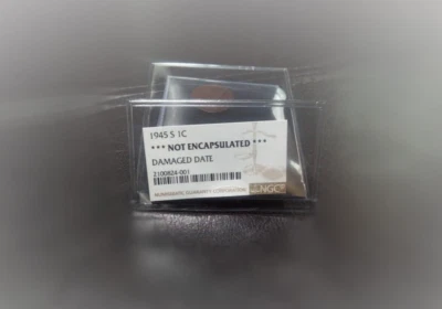 1945 s 1c Copper Wheat Cent NGC Damaged Date  - Image 1 of 2