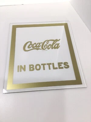 Coca-Cola vintage em garrafas ouro em vidro painel marca registrada 8 3/16” X 9 7/16” - Imagem 1 de 2