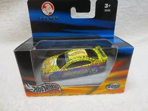 COMMODORE YELLOW HOT WHEELS 2001 LANZAMIENTO EN CAJA ESCALA HOLDEN 1:64 - Imagen 1 de 3