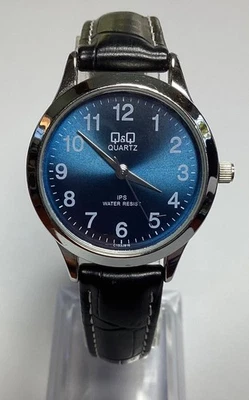 "Reloj para mujer Q&Q esfera azul plateada correa negra resistente al agua batería nueva 7,25""" Foto 1 de 4