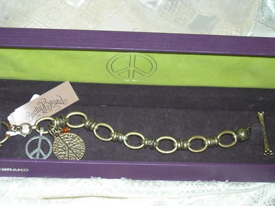 BRAZALETE CON DIJE DE PIEDRA SEMIPRECIOSA MARCA LUCKY SIGNO DE LA PAZ EN TONO DORADO NUEVO EN CAJA Foto 1 de 3