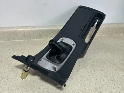 MITSUBISHI ECLIPSE 2006-2012 MANUAL CONSOLA CENTRAL PALANCA DE CAMBIOS BISEL PORTAVASOS OEM Foto 1 de 4