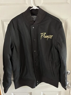 Chaqueta de Lana Prince Bomber Negra Y Dorada Bordada Símbolo Adulto Talla Mediana Foto 1 de 4